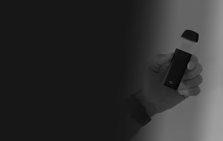 Hand holding a custom branded disposable vape