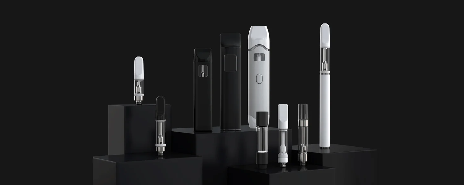 Assortment of empty cartridges and disposable vapes